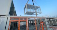 A modular unit is lifted into place at Rovex’s 81-room workforce lodging project in San Juan, Puerto Rico, which is financed by Monllor Capital Partners.