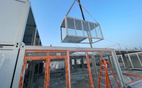 A modular unit is lifted into place at Rovex’s 81-room workforce lodging project in San Juan, Puerto Rico, which is financed by Monllor Capital Partners.