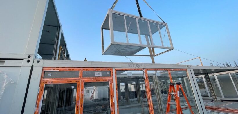 A modular unit is lifted into place at Rovex’s 81-room workforce lodging project in San Juan, Puerto Rico, which is financed by Monllor Capital Partners.