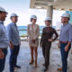 The ICON project’s executives gather on the rooftop in Condado to mark the completion of the building’s top floor.