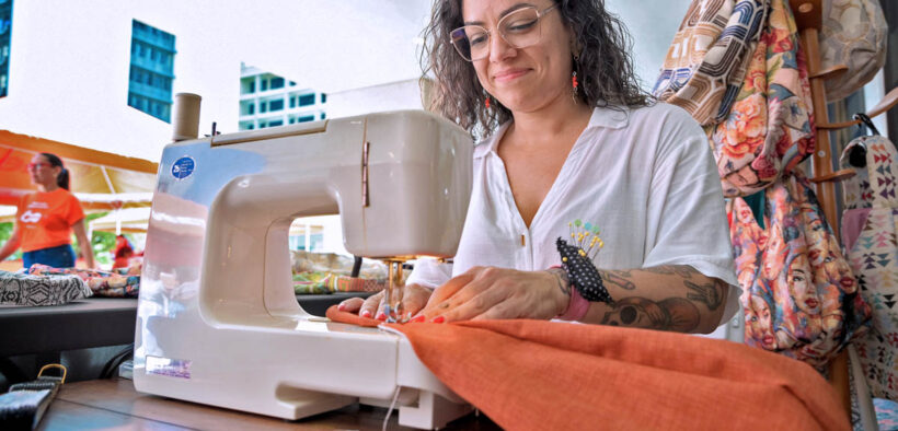An entrepreneur supported by Oriental works on her products ahead of the bank’s Christmas Business Market in San Juan’s Hato Rey district.