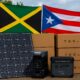 Solar equipment donated by Puerto Rico’s renewable energy sector awaits shipment to Jamaica as part of relief efforts following Hurricane Melissa’s devastation. (Image generated by ChatGPT)