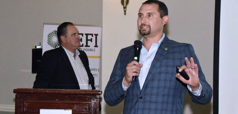 On right, Ricardo E. Ríos-Flores, president of Commercial Equipment Finance Inc.
