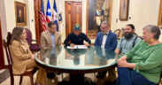 From left: Vanessa Jiménez, director of the Municipality of San Juan’s legal division; Germán Rauli-Ufret; San Juan Mayor Miguel Romero; Reynaldo R. Alegría, chair of the board of trustees of the Center for Advanced Studies on Puerto Rico and the Caribbean; Ricardo Magriñá, interim rector; and Sonya Canetti, board member, take part in the signing of the property transfer in San Juan.
