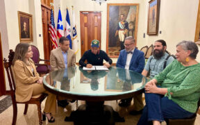 From left: Vanessa Jiménez, director of the Municipality of San Juan’s legal division; Germán Rauli-Ufret; San Juan Mayor Miguel Romero; Reynaldo R. Alegría, chair of the board of trustees of the Center for Advanced Studies on Puerto Rico and the Caribbean; Ricardo Magriñá, interim rector; and Sonya Canetti, board member, take part in the signing of the property transfer in San Juan.