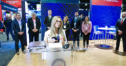 InvestPR CEO Ella Woger-Nieves speaks during a presentation on Puerto Rico’s investment results at an industry event.