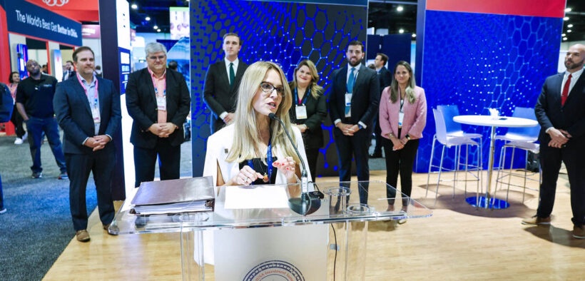 InvestPR CEO Ella Woger-Nieves speaks during a presentation on Puerto Rico’s investment results at an industry event.