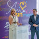 Hogar Ruth Executive Director Lisdel Flores-Barger and Aerostar Airport Holdings CEO Jorge Hernández stand before the new mural unveiled at Puerto Rico’s Luis Muñoz Marín International Airport to support survivors of domestic violence.