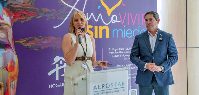 Hogar Ruth Executive Director Lisdel Flores-Barger and Aerostar Airport Holdings CEO Jorge Hernández stand before the new mural unveiled at Puerto Rico’s Luis Muñoz Marín International Airport to support survivors of domestic violence.