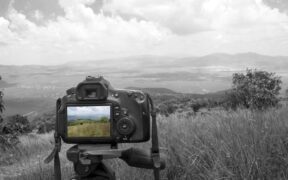 Raúl Burgos uses a camera tripod to show how three points of support stay steady, a lesson he applies to the elements that keep Puerto Rico companies stable. (Credit: Arturoosorno | Dreamstime.com)