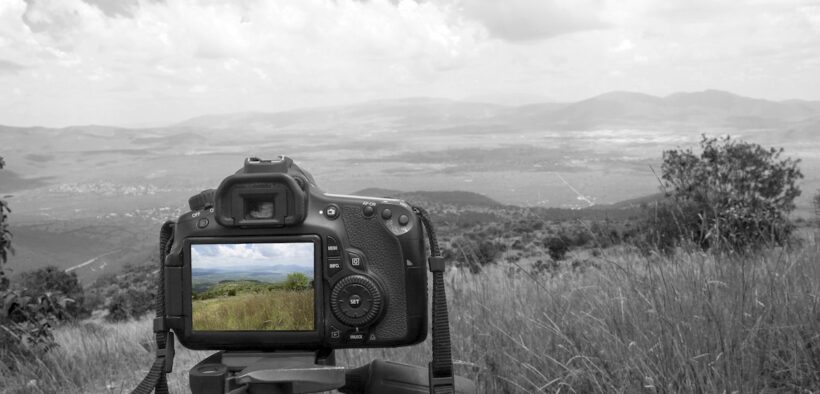 Raúl Burgos uses a camera tripod to show how three points of support stay steady, a lesson he applies to the elements that keep Puerto Rico companies stable. (Credit: Arturoosorno | Dreamstime.com)