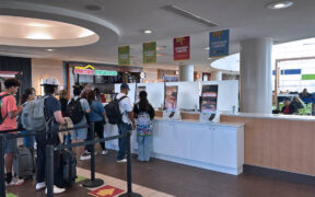 Customers use a self-service food ordering kiosk at Luis Muñoz Marín International Airport.