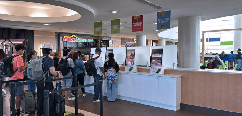 Customers use a self-service food ordering kiosk at Luis Muñoz Marín International Airport.